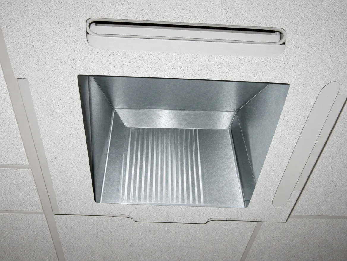 The same ceiling AC grille and duct opening after cleaning